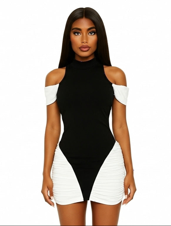 Woman wearing a black and white dress on a white background