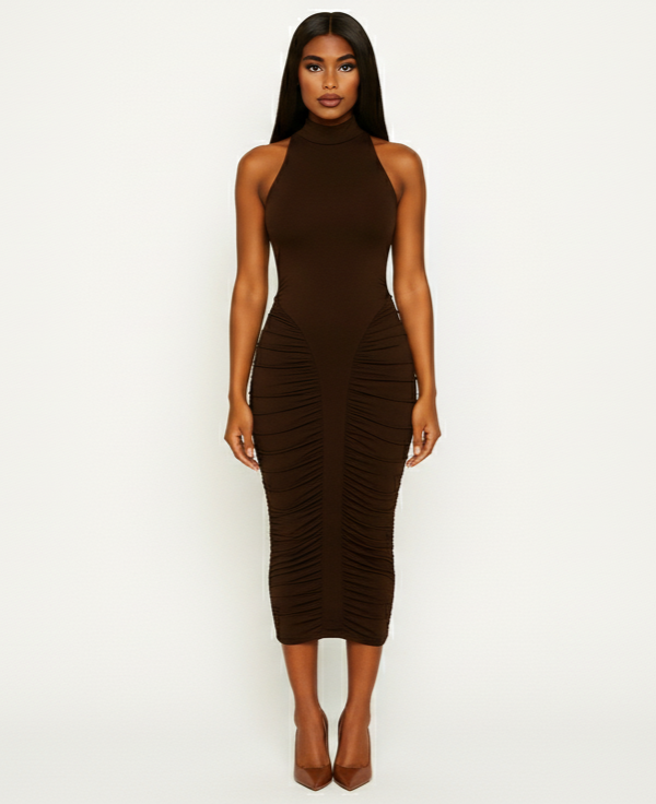Woman wearing a brown halter neck dress with ruched sides on a white background