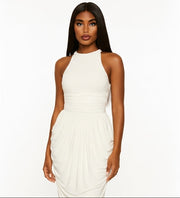Woman wearing a white halter neck dress on a white background