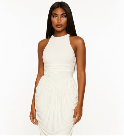 Woman wearing a white halter neck dress on a white background