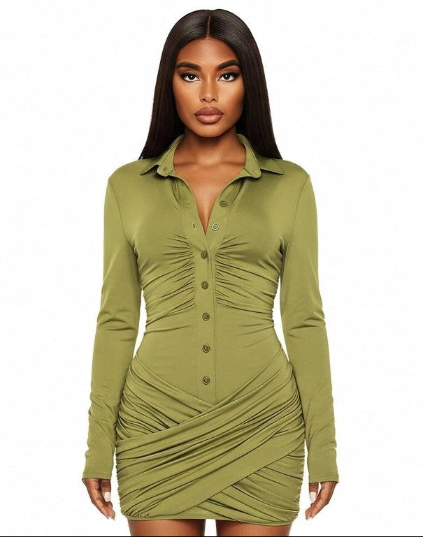 Woman wearing a green ruched dress on a white background