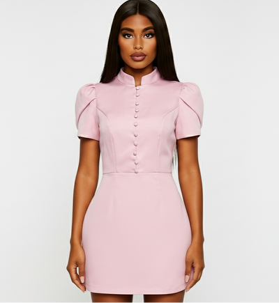 Pink dress on a woman against a white background