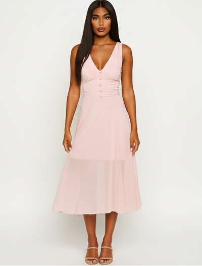 Woman wearing a pink dress against a white background