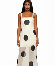Woman wearing a polka dot dress on a white background