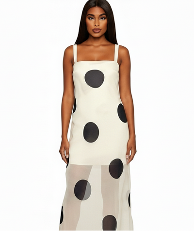 Woman wearing a polka dot dress on a white background