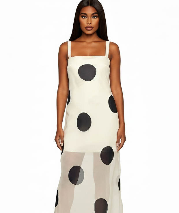 Woman wearing a polka dot dress on a white background