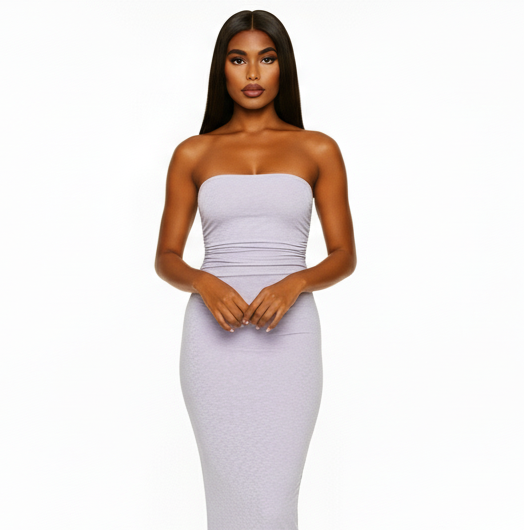 Woman wearing a strapless white dress on a white background