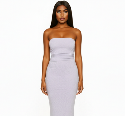 Woman wearing a strapless white dress on a white background