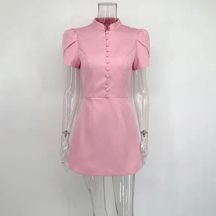 Pink dress on a mannequin against a white background