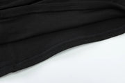 After Dusk Draped Mini Dress with Jeweled Brooch – Black
