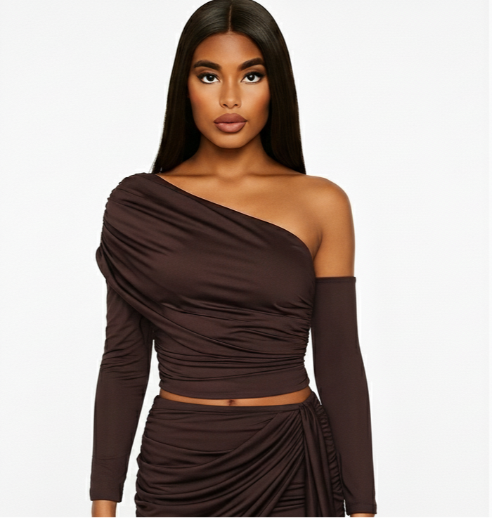 Woman wearing a brown one-shoulder dress on a white background